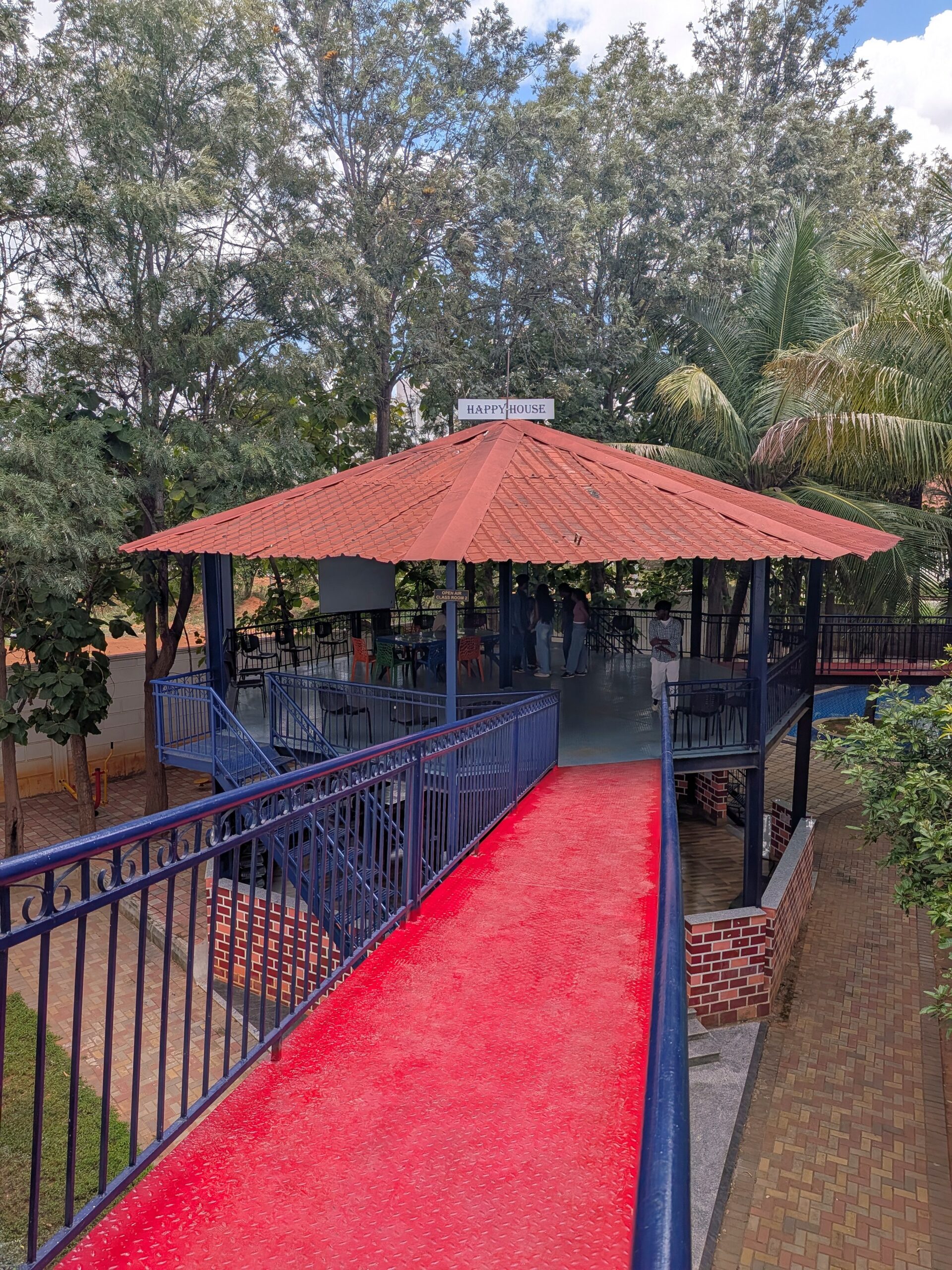 Outdoor seating along the garden walkway
