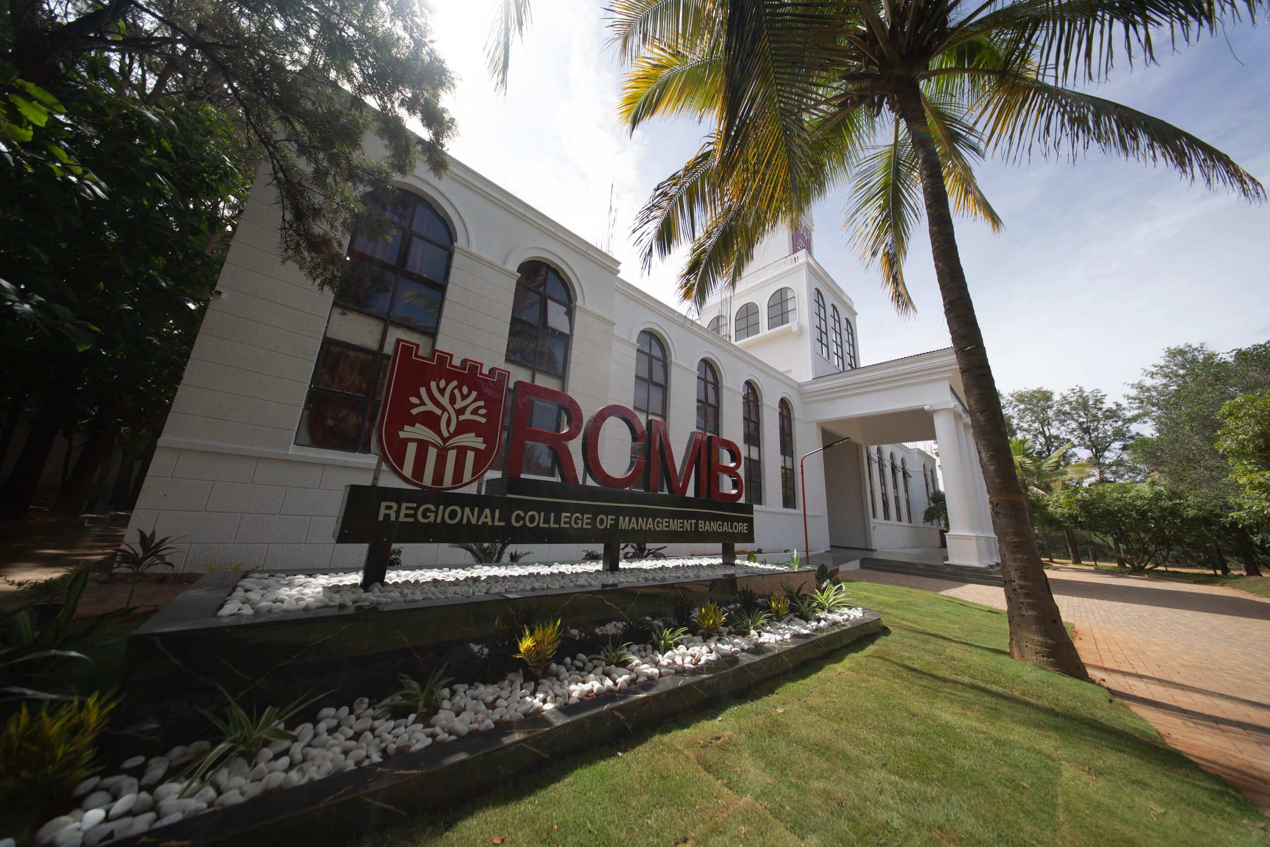 RCMB main entrance with white columns and college signage